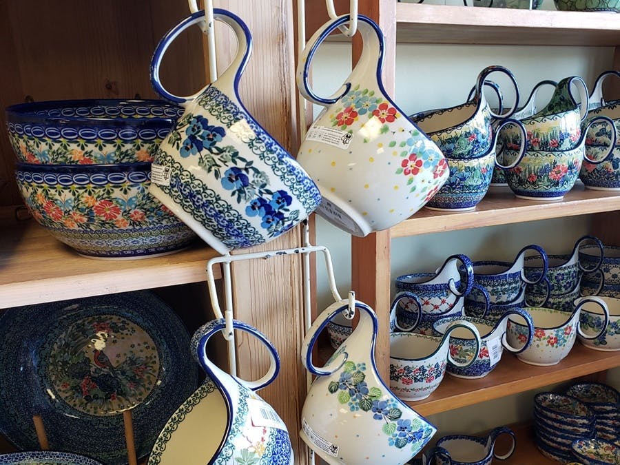 hutch with pottery on it